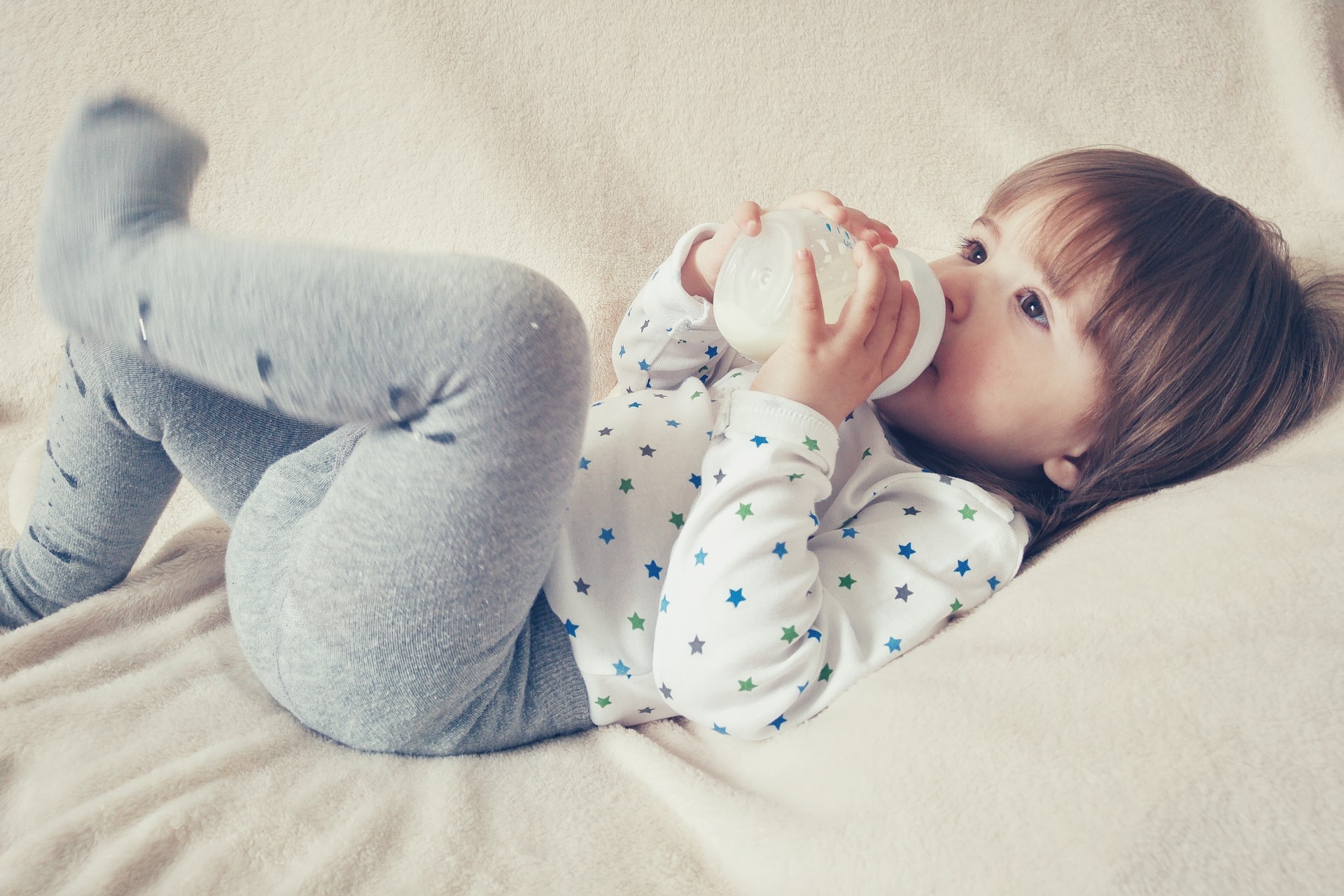 A child drinking out of a sippy cup.