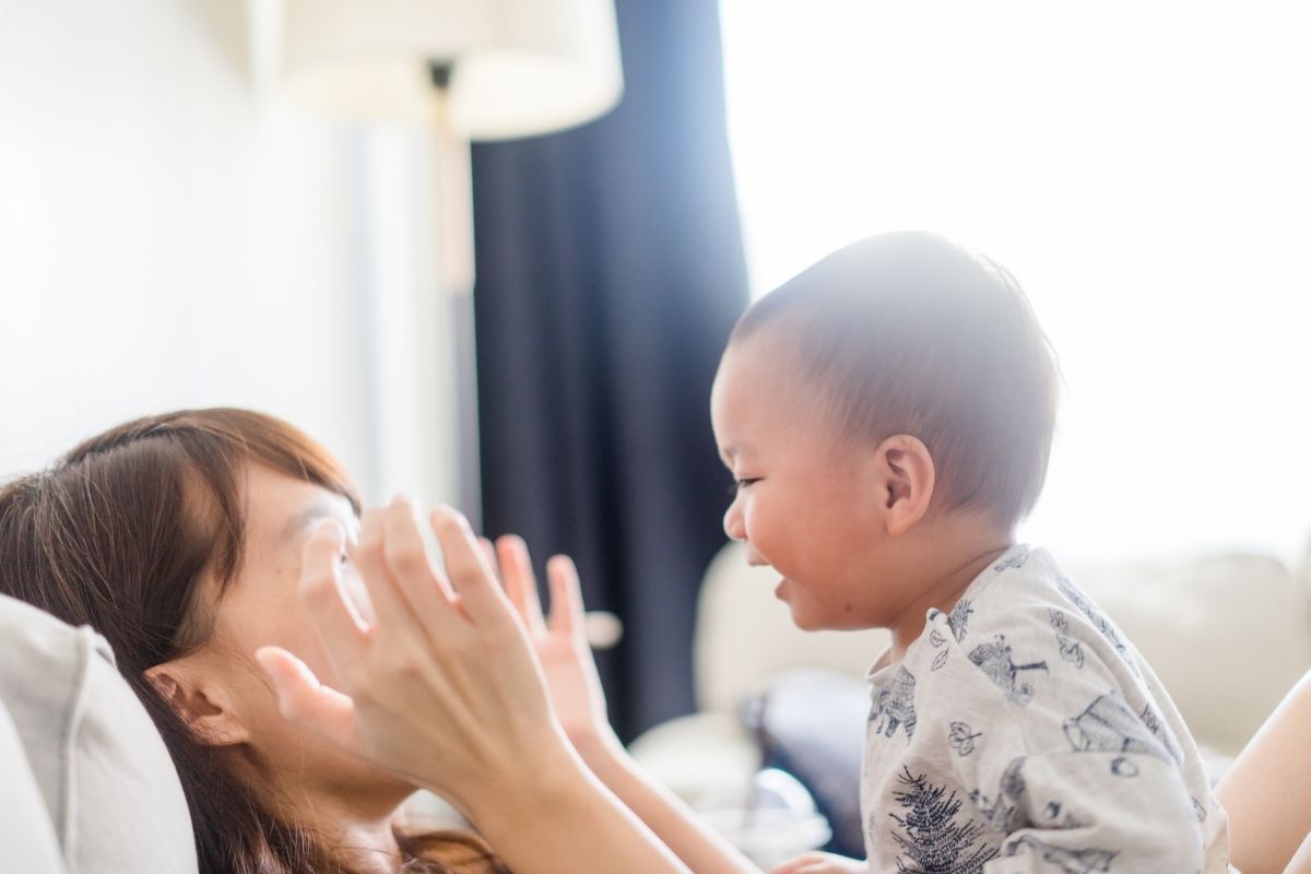 When do babies play peekaboo and why do they play it? | NewFolks