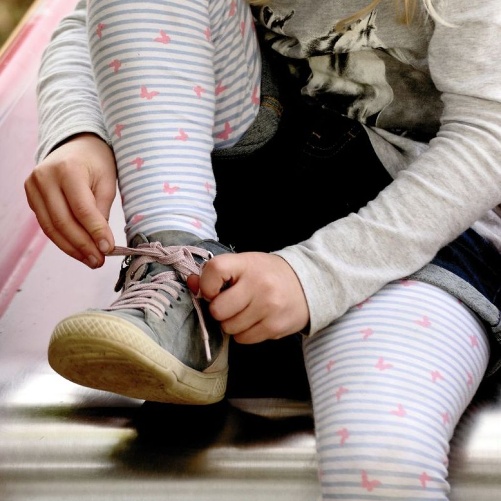Child Tying Their Shoe