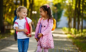 two girls walking at school