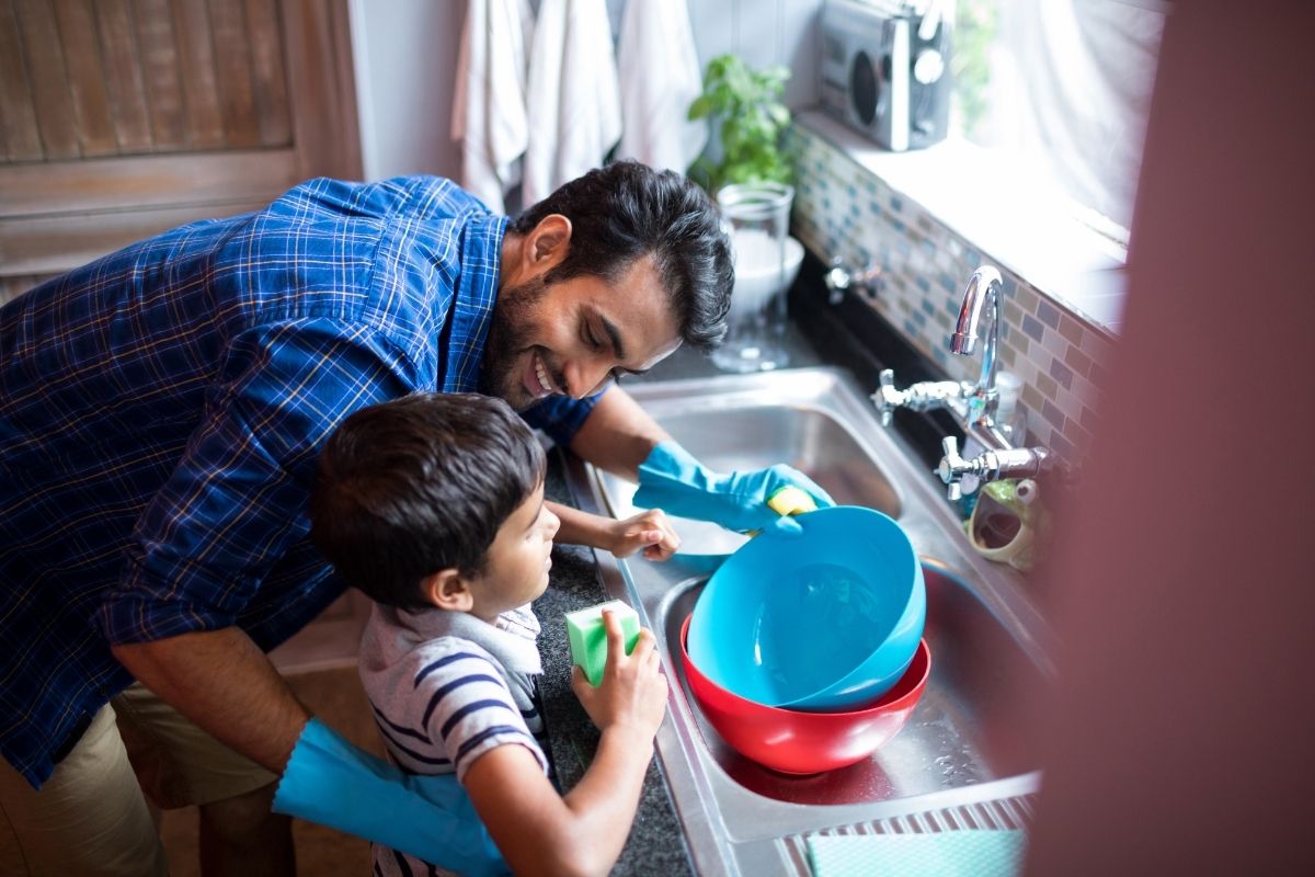 son helping dad with chore
