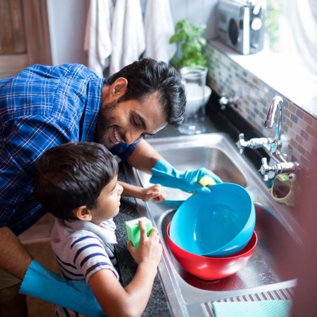 son helping dad with chore