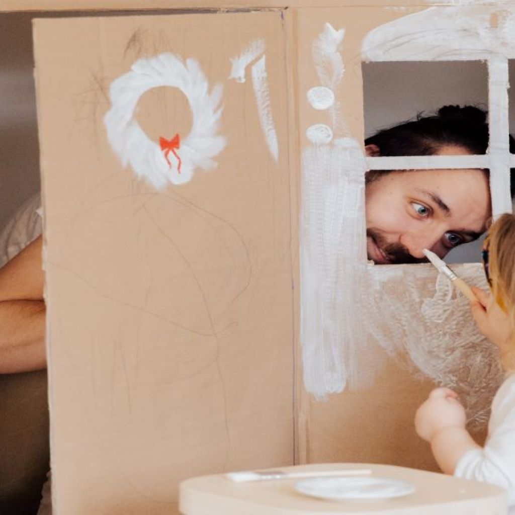 little girl painting play house