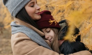 mom with daughter in tree