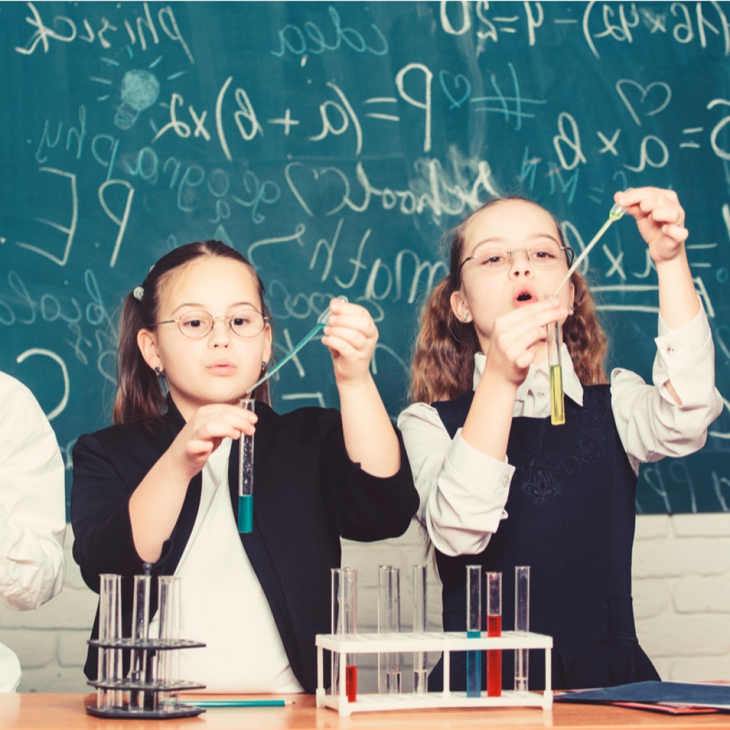A group of grade schoolers doing a science class.