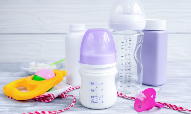 A few baby bottles on a table.