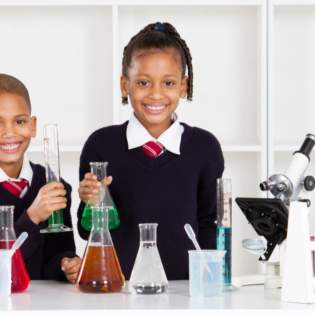 Two grade school kids doing a fun science experiment.