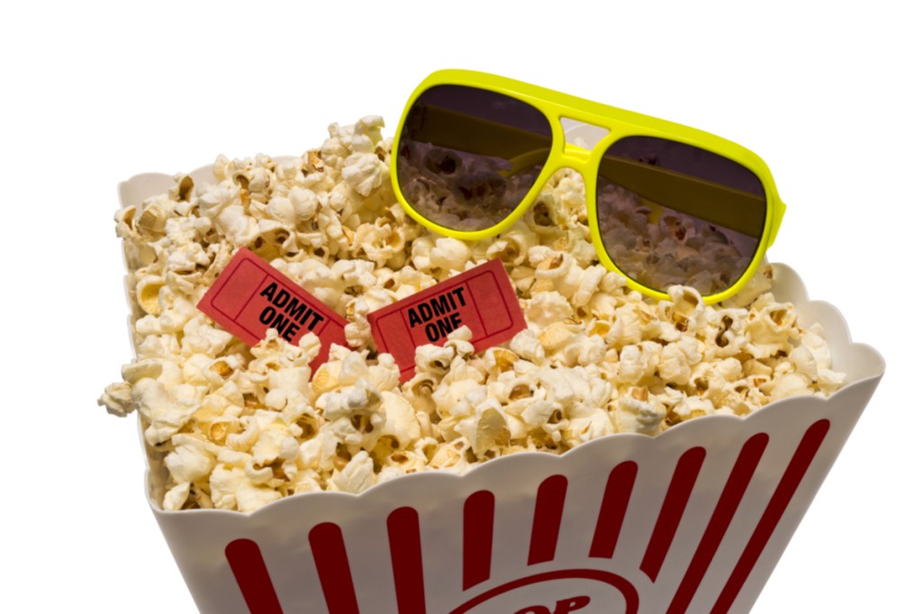 Popcorn with sunglasses and movie tickets