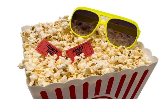 Popcorn with sunglasses and movie tickets