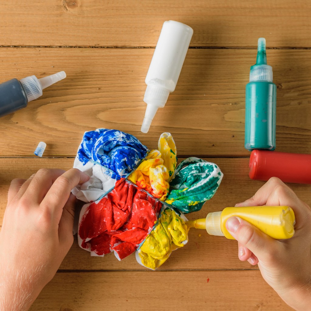 Applying the dye for a DIY tie-dye project.