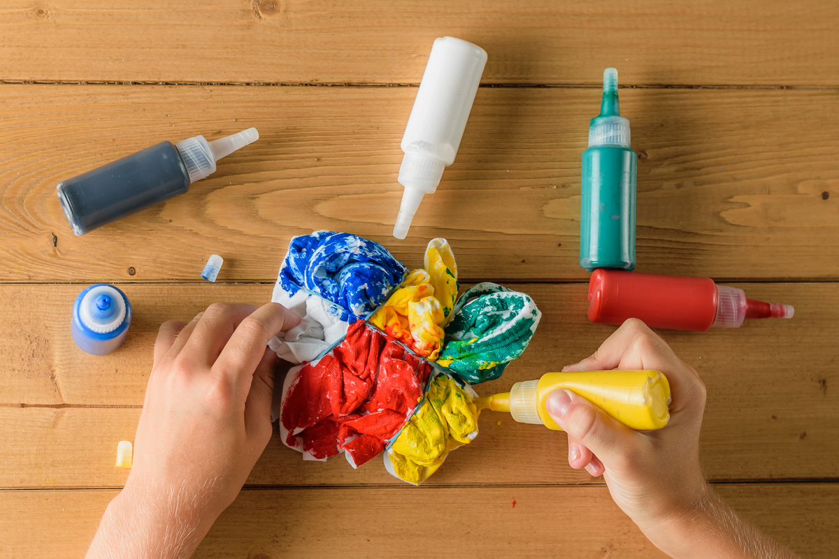 Applying the dye for a DIY tie-dye project.