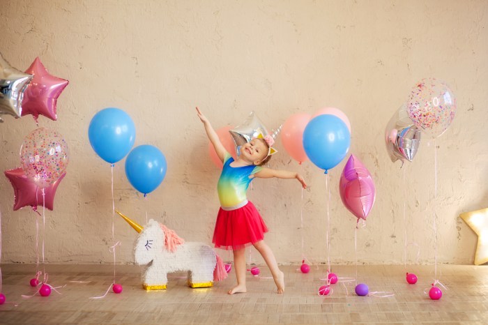 Little girl excited for her unicorn-themed birthday party