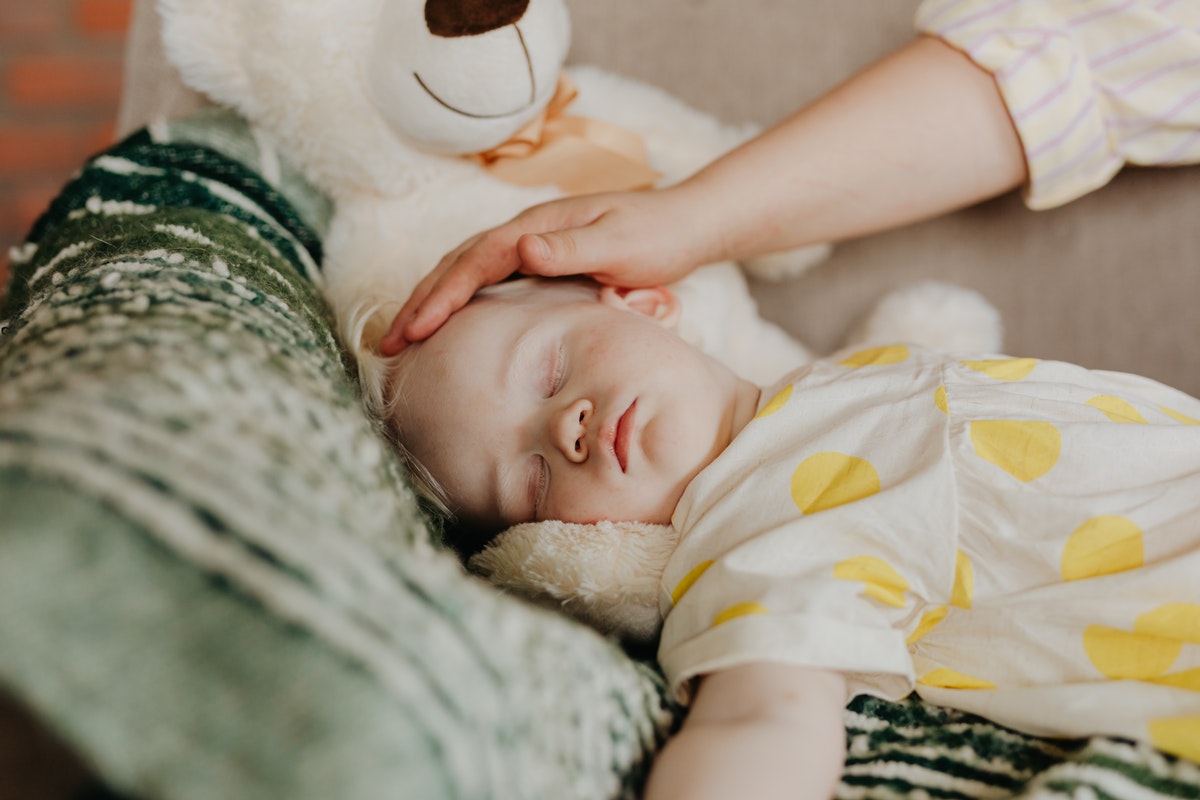 Baby girl in yellow sleeping