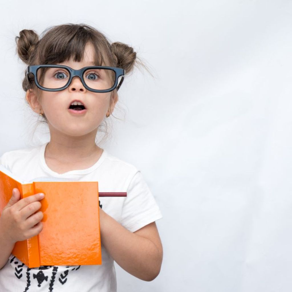 Girl With Glasses Holding Book