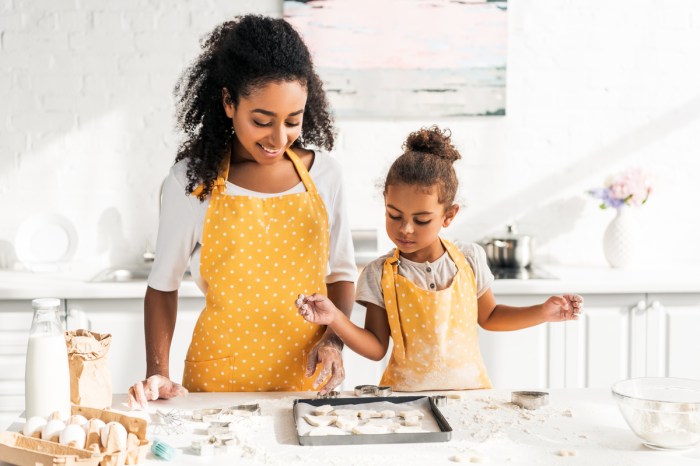 Mother and daughter having fun cooking.