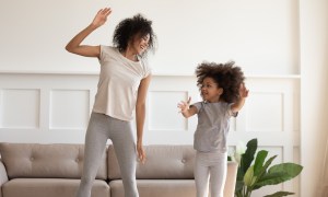 Mom and daughter playing musical game.