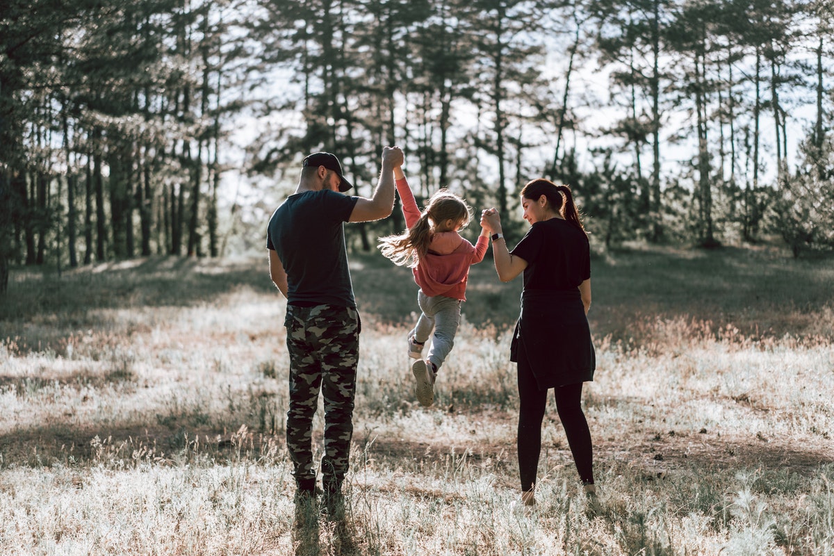 A family enjoying the beautiful outdoor weather.
