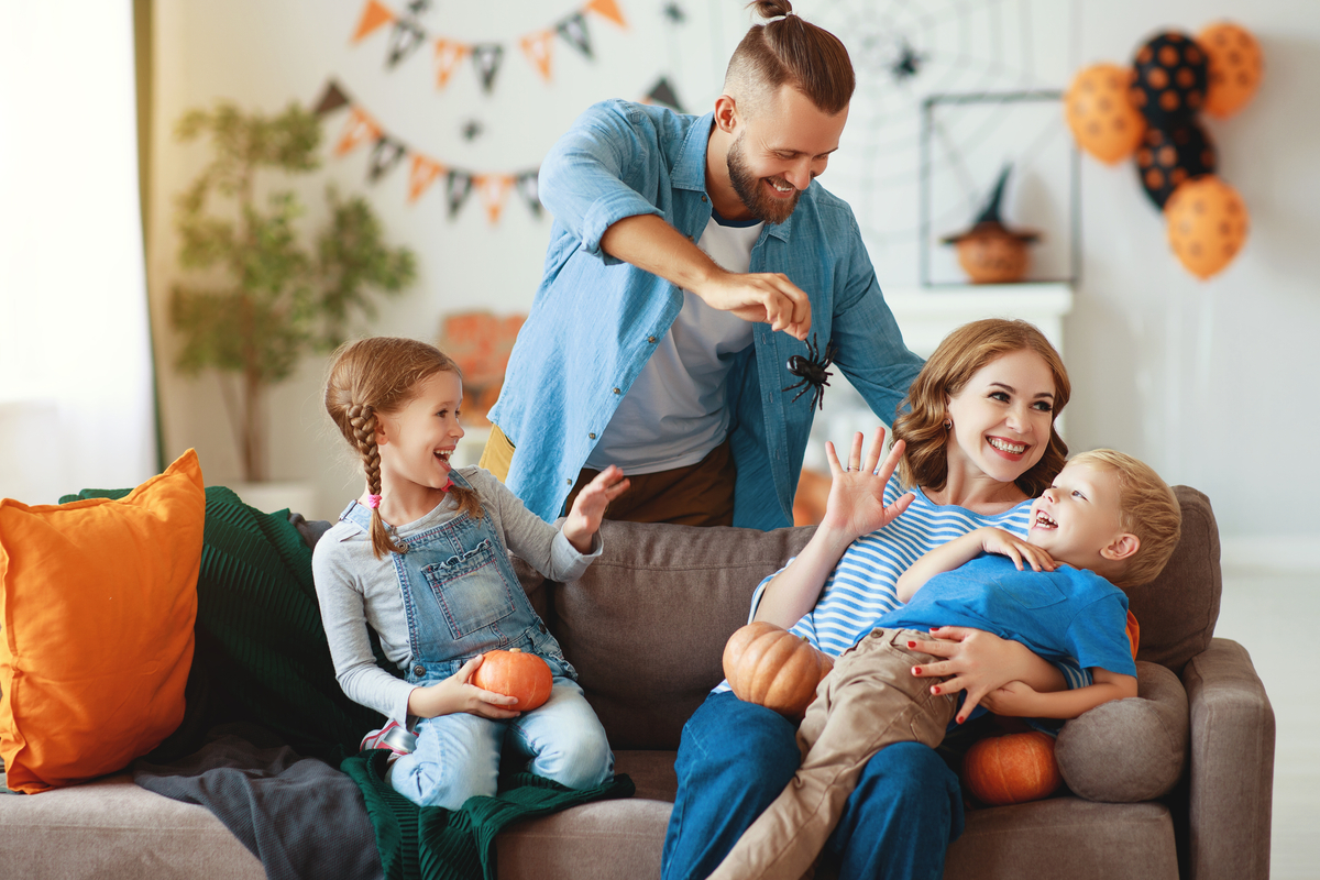 A family enjoying decorating for fall.