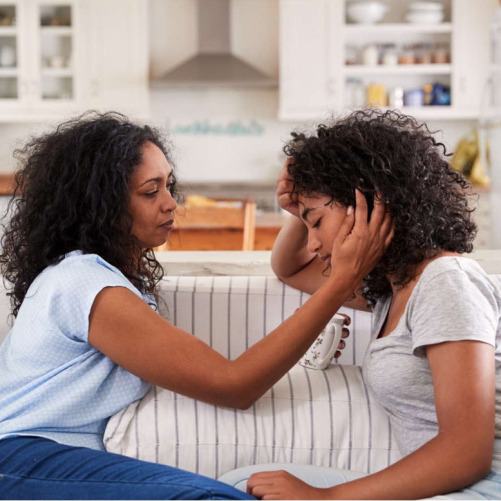A mother and daughter having an intimate conversation