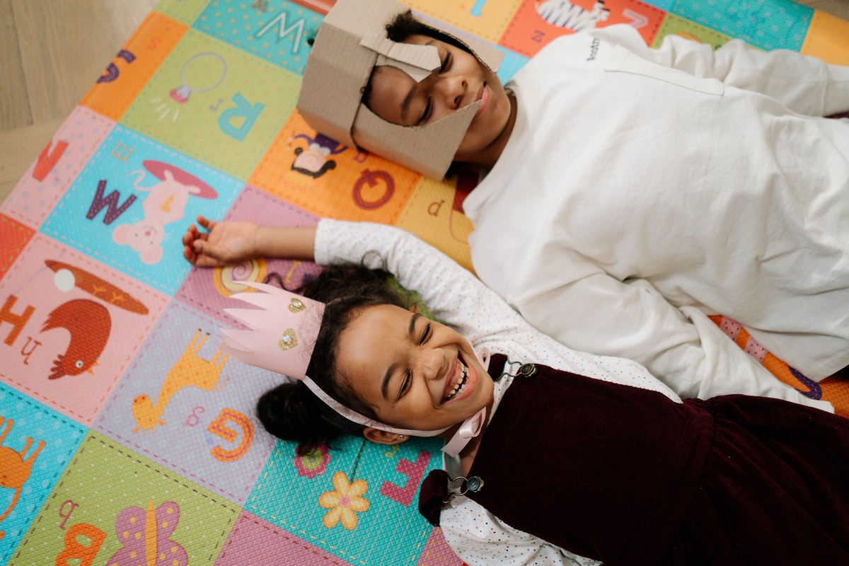 two siblings with royal, homemade costumes