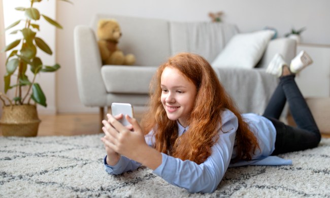 Teen on social media on her smartphone