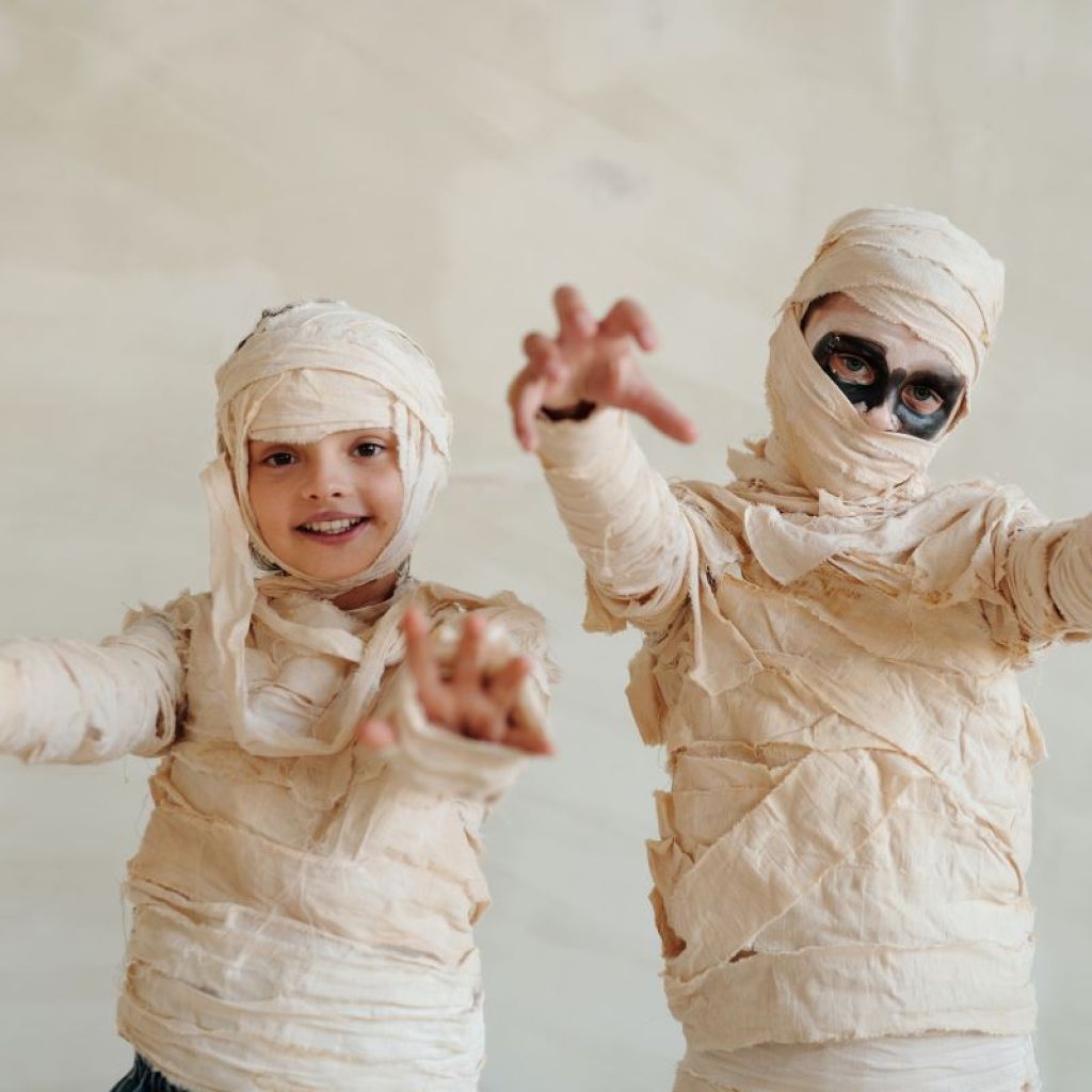 children dressed as mummies