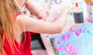 Child painting at an art-themed painting party