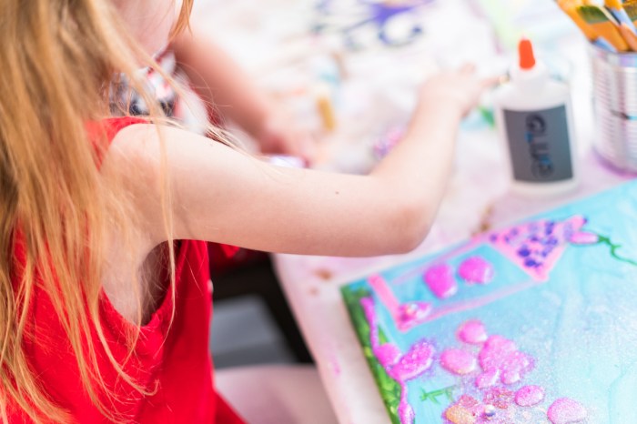 Child painting at an art-themed painting party
