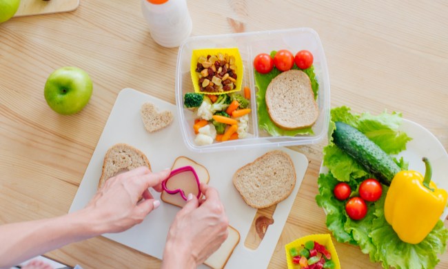 Parent putting together a colorful lunch