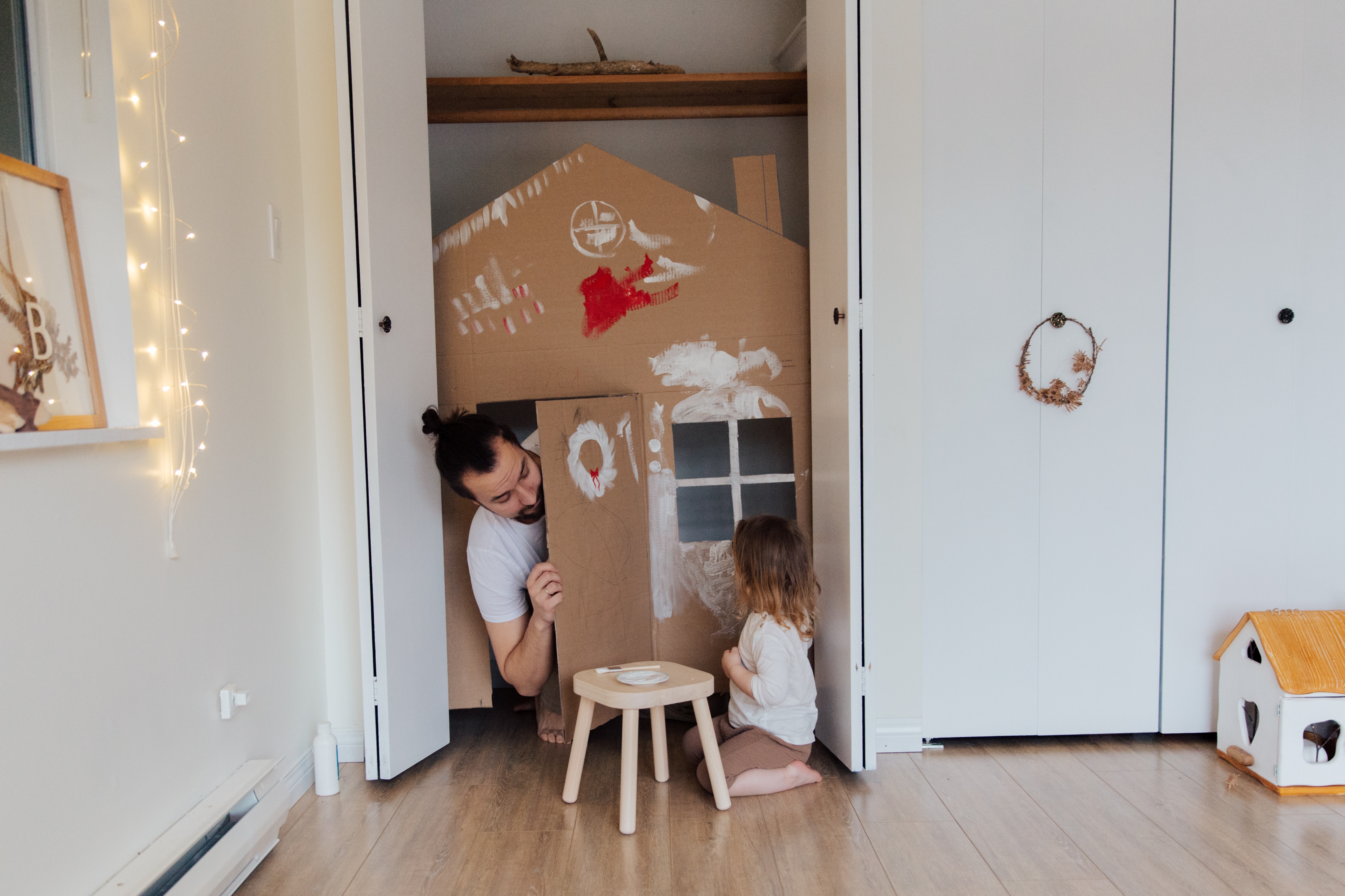 Dad and daughter painting play house
