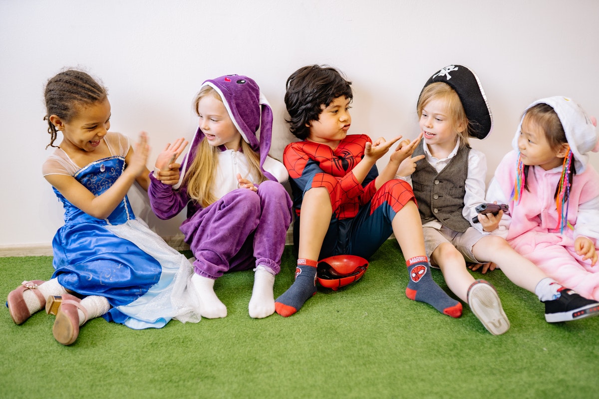 A group of kids dressed up in costumes