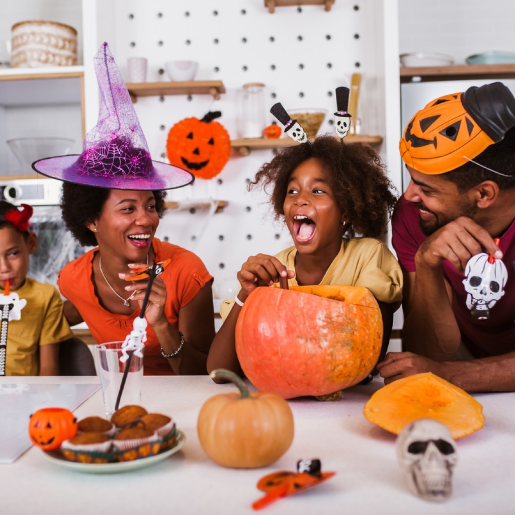 A family doing a Halloween craft.