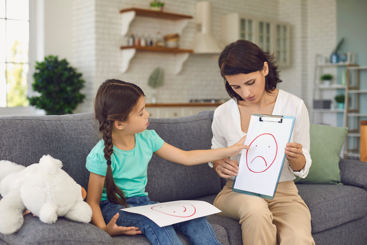A mother teaching her daughter about emotions.