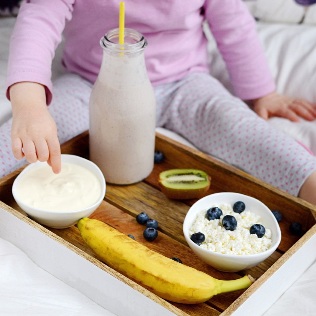 A toddler with their lunch.