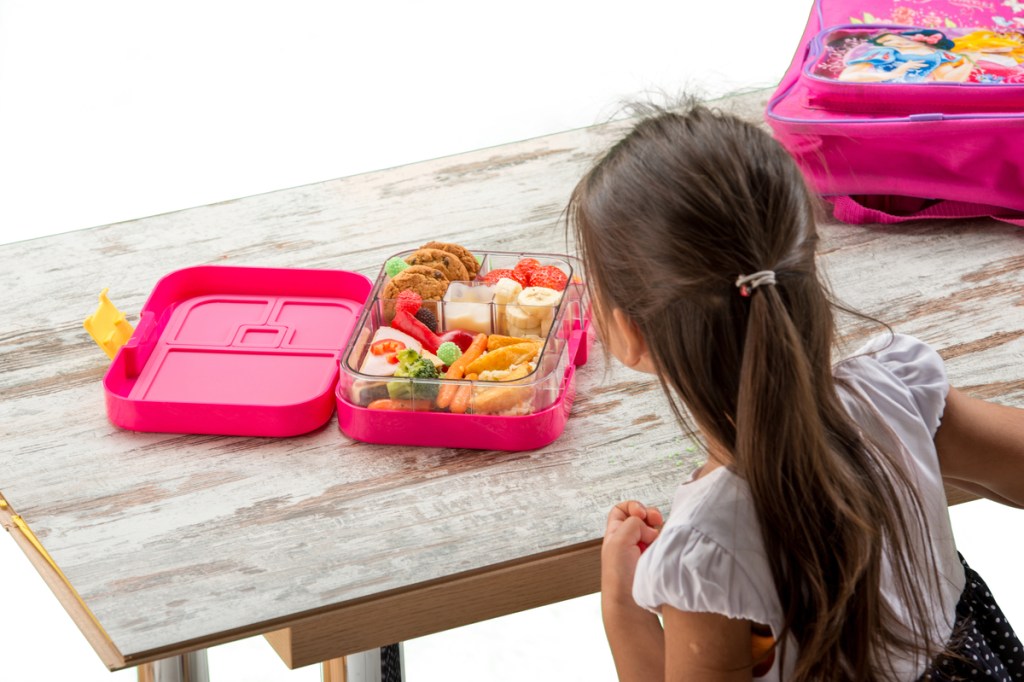 A child eating her school lunch