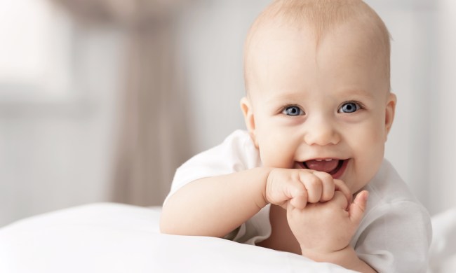 happy baby learning to sign