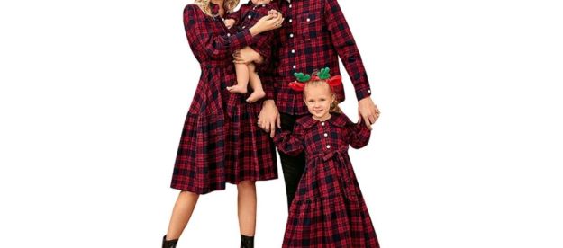 A family posing in matching Christmas outfitss.