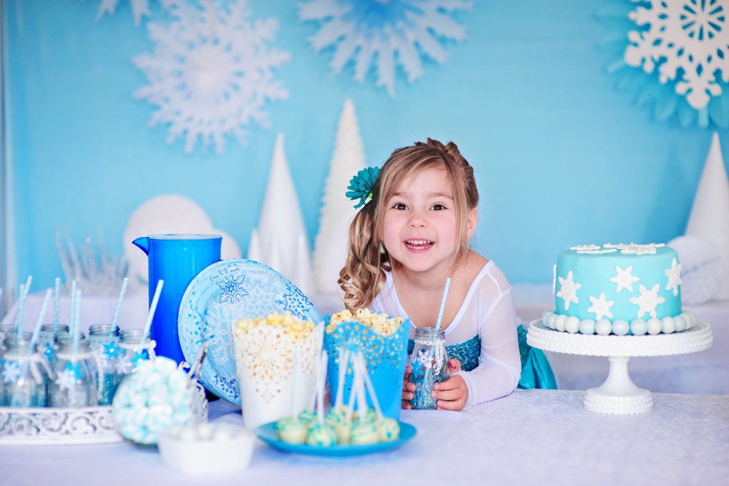 Happy girl ready for Frozen themed birthday party