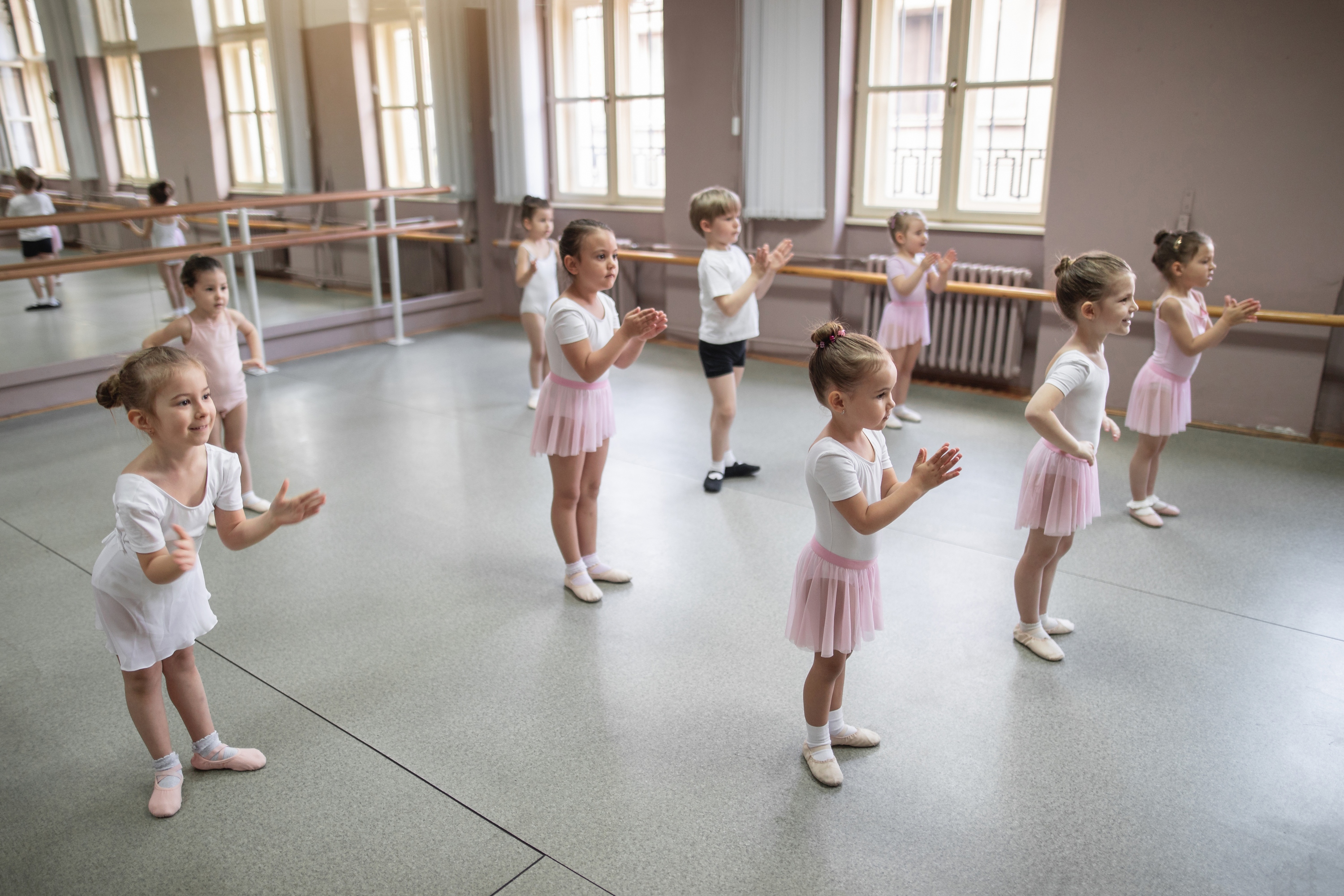 Cheerful toddlers at a ballet dancing studio