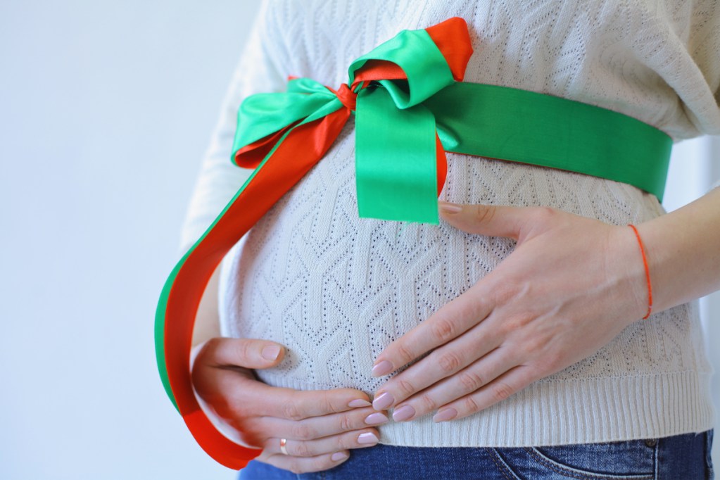 Baby bump wrapped up like a Christmas present