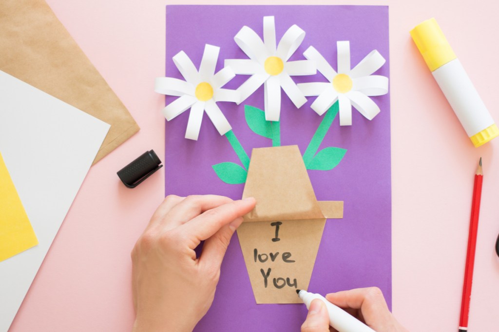 child making paper flower craft