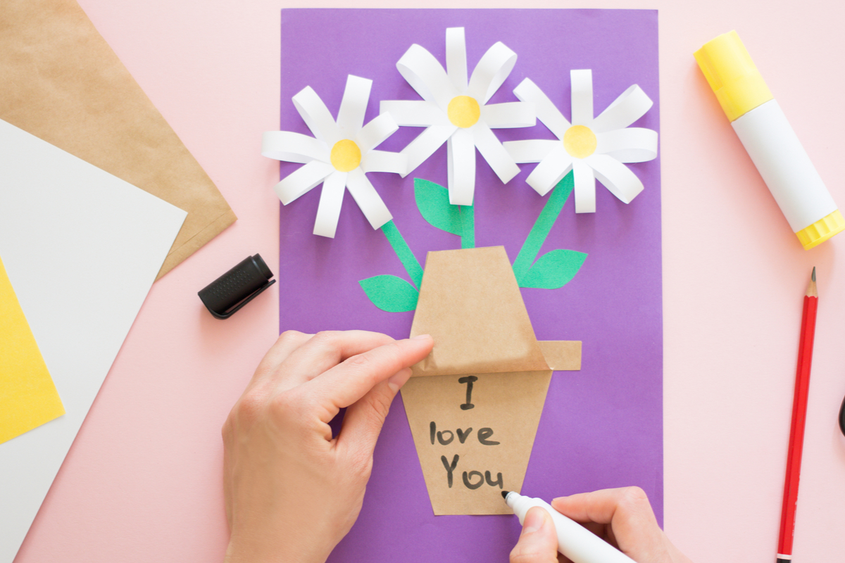 child making paper flower craft