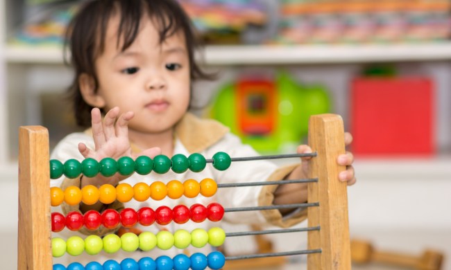 Toddler learning to count with an abacus