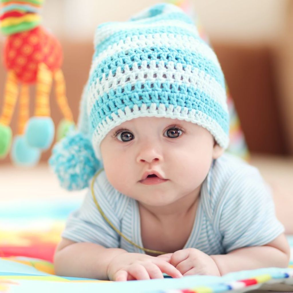Baby boy wearing a blue knitted cap
