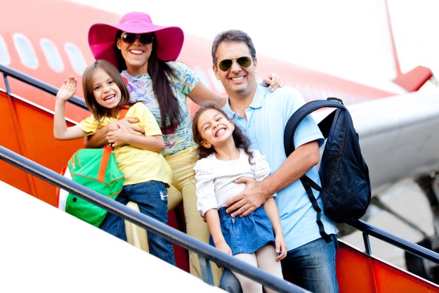 Excited family boarding an airplane for family reunion