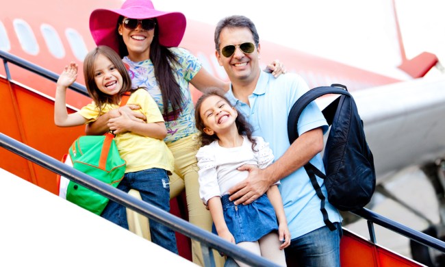 Excited family boarding an airplane for family reunion