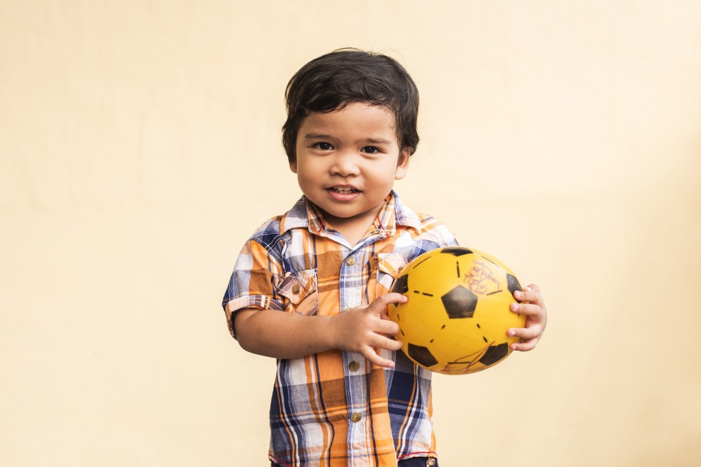 toddler-boy-holding-soccer-ball