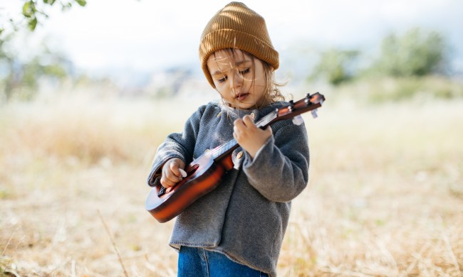 Toddler playing guitar