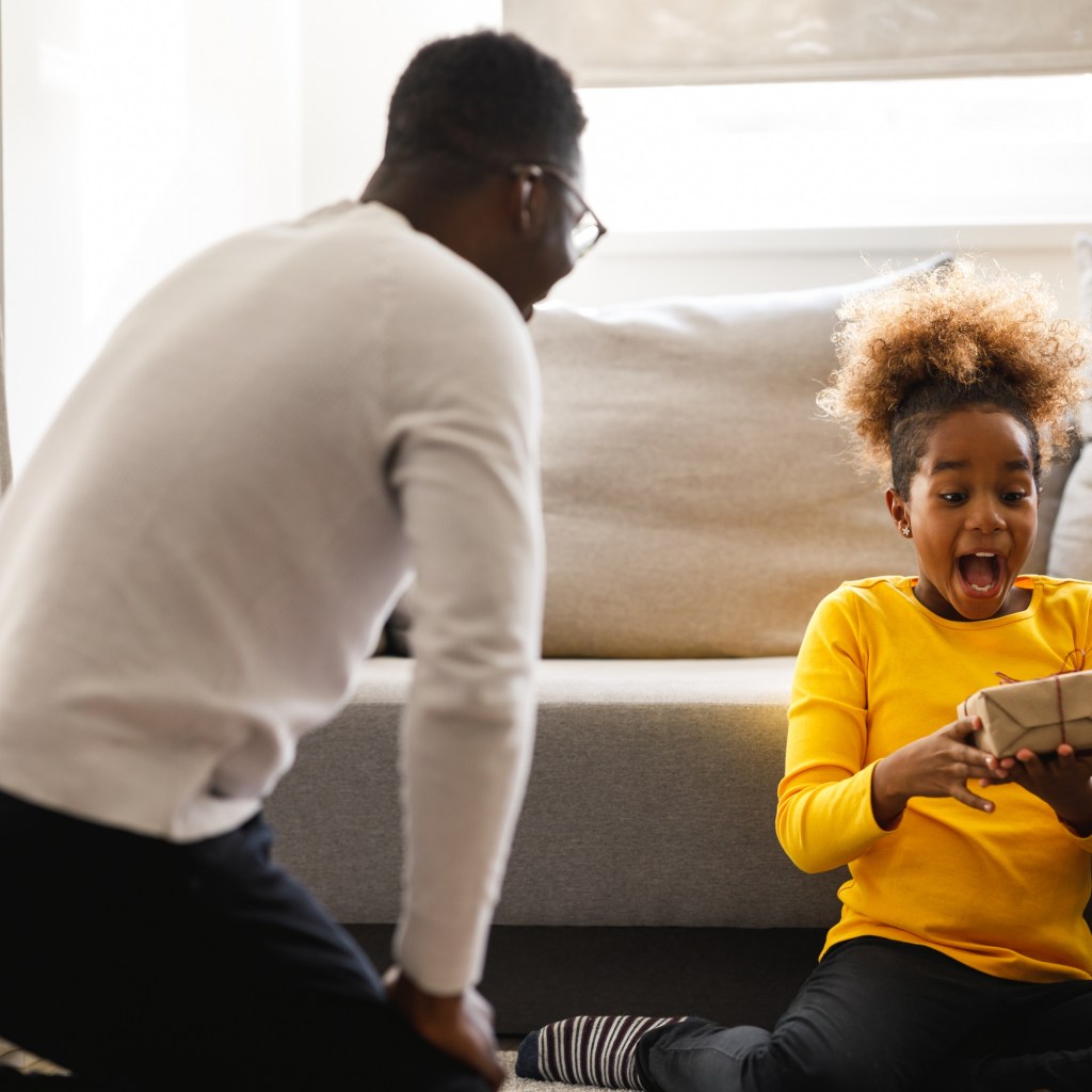 Young girl excited about her Christmas present