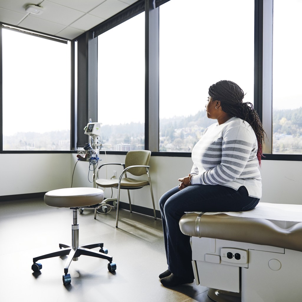 Worried pregnant woman at a doctor's office